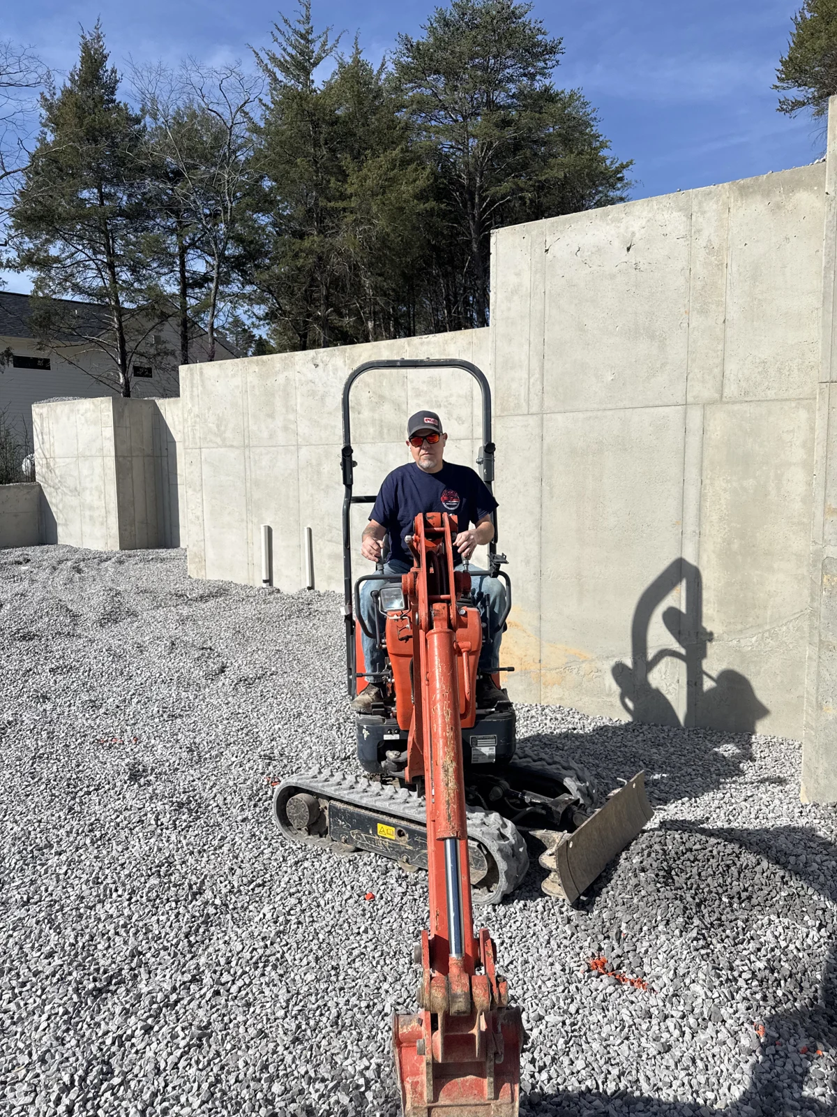 Operating an excavator at a foundation site