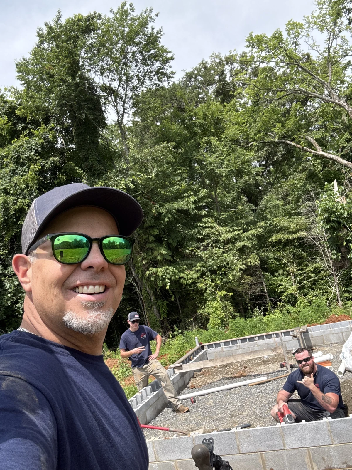 The crew at an outdoor plumbing project