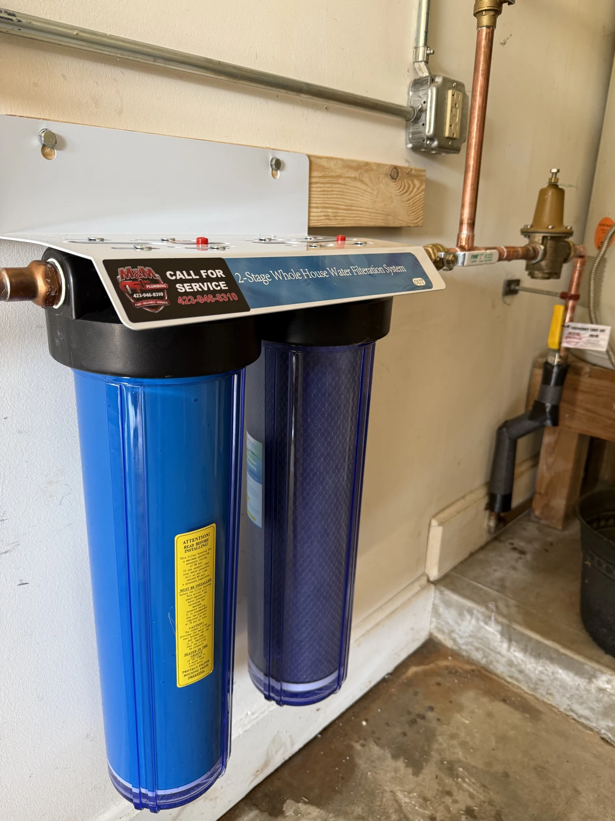 Two-stage whole-house water filter installation